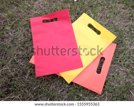3 Eco Friendly colored Bags, Non Woven Polypropylene Bags on grass, Reusable shopping bag, Gift Bag, Reduce, Reuse, Recycle,