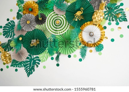 Green, emerald, gold and yellow papers circle shape of origami. Abstract background of paper designs. Copy space.