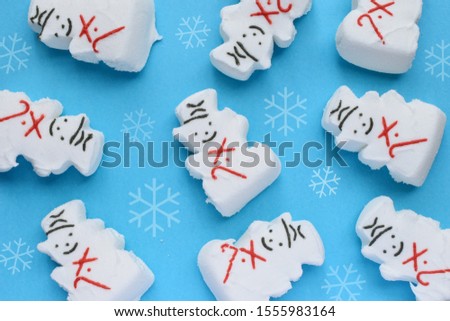 Marshmallow snowman’s on a blue background