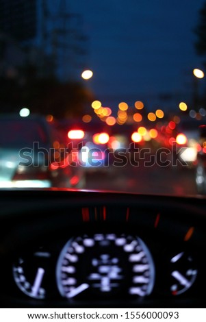 light of traffic jam on night street, image blur urban road background