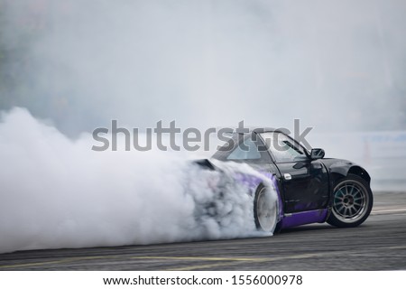 Motion Blur side view drift car  Royalty-Free Stock Photo #1556000978