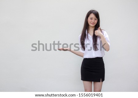 Portrait of thai adult student university uniform beautiful girl show hand