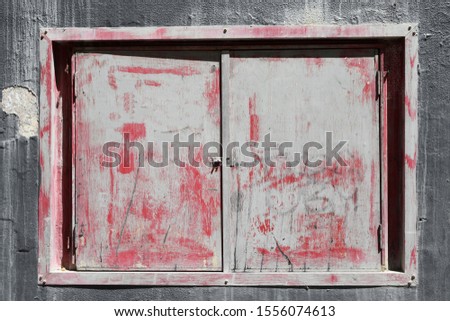 Old urban weathered fire equipment box on wall