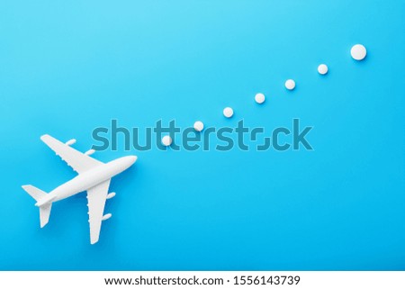 White model of a passenger plane with dotted trajectory points isolated on background. The route of the aircraft in the countries and the sky.