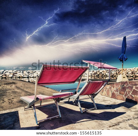 Pink Beach Chairs on a stormy night.