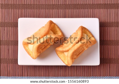 Cream waffles on white plate