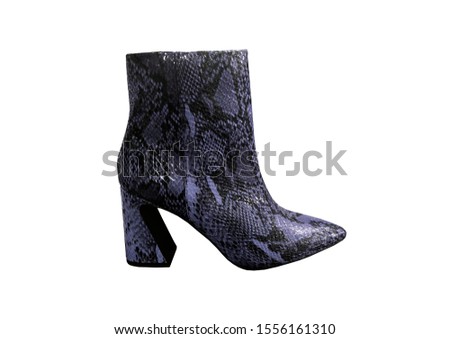 Purple women's snakeskin Cowboy Boots isolated on white background. Snake Cowboy Ankle Boots pattern. 