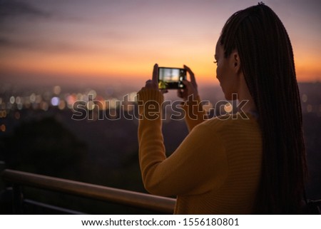 Woman viewing panorama of a modern city
