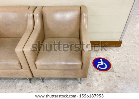 public sofas or waiting chairs and wheelchair space in clinic or hospital