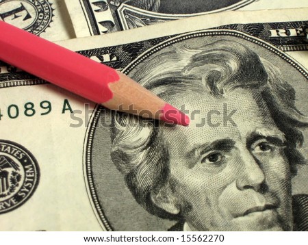 money (dollars) with red pencil