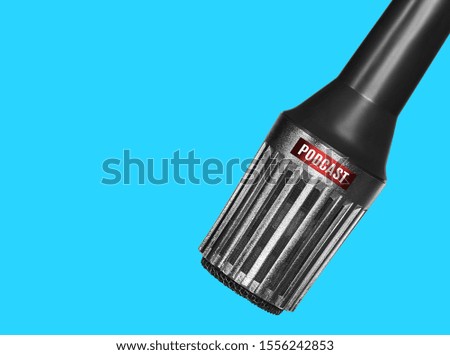 retro microphone isolated over blue background