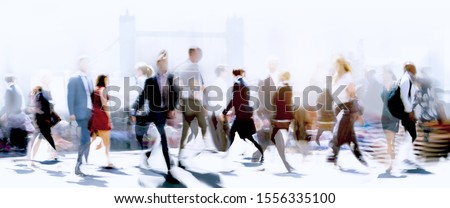 Walking people blur. Lots of people walking in the City of London. Wide panoramic view of people crossing the road.  Royalty-Free Stock Photo #1556335100