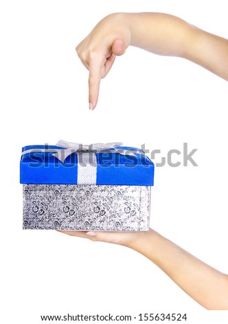 Blue gift on woman hand with gesture finger down, isolated on a white background