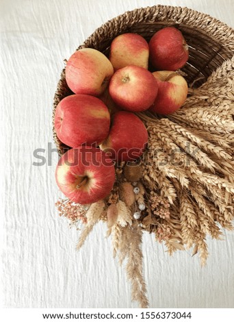 Apples in a basket on the table.