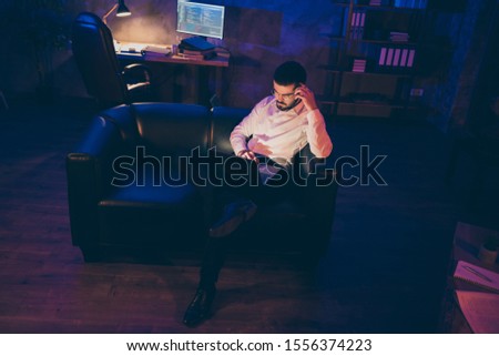 Full length body size photo of pensive interested man looking pensively into laptop screen in search of bugs to be fixed finding code issues