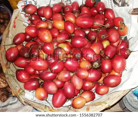 Tree tomato, Tamarillo an egg shaped edible fruits in basket for sale in marketplace