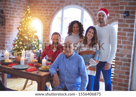 Beautiful family smiling happy and confident. Posing with tree celebrating Christmas at home