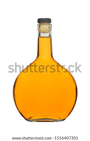Bottle of cognac closed with a cork on a white background