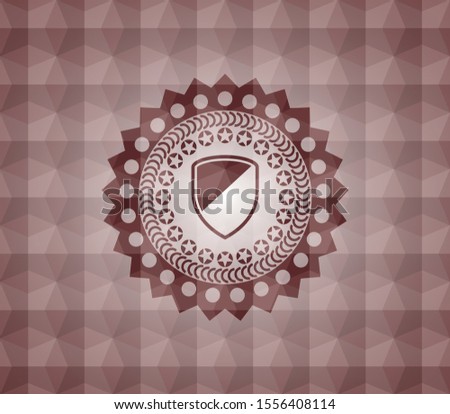 armor icon inside red seamless emblem with geometric pattern.