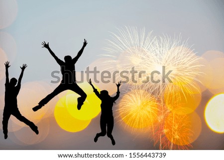 Silhouette happy business teamwork jumping and cheering crowd fireworks congratulation graduation in Happy New year 2020. Freedom lifestyle group people jump as part of Number 2020 at the sunset beach