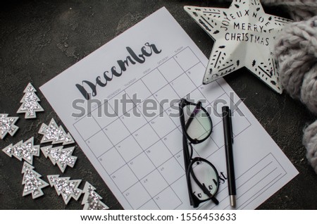 2019 year end review, date planning, appointment, deadline or holiday concept on wooden table next to clean calendar on month of December.
