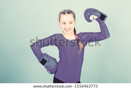 Happy child sportsman in boxing gloves. Sport success. sportswear fashion. Fitness diet. energy health. workout of small girl boxer. punching knockout. Childhood activity. Happy and sporty.