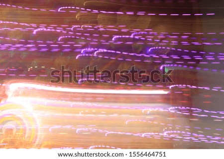Dynamic lights in dark background. High speed in night time abstraction. Colorful LED light trails background. Motion blur effect.