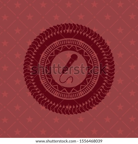 microphone icon inside realistic red emblem