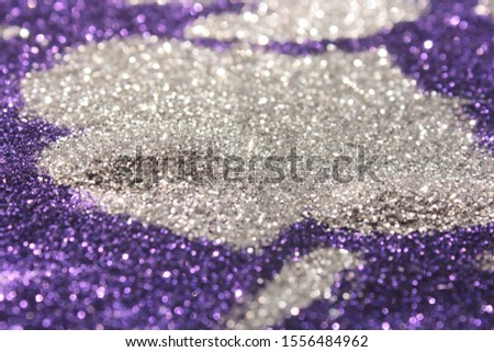 Glitter colorful art blink shimmer shiny background blurred purple wallpaper. Luxury glowing detail design new year and Christmas party cerebration.