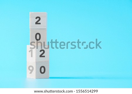 wood cubes changing from New year 2019 to 2020 concept on isolated background with copy space