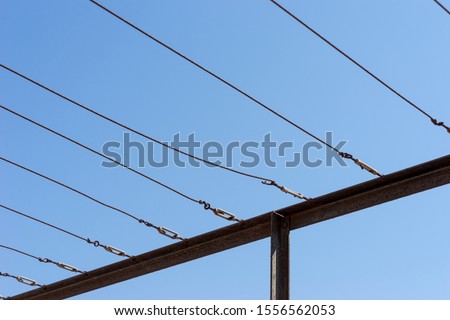 Clothes lines with a clear blue sky as background