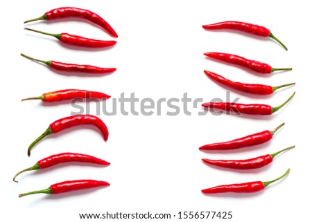 Flat lay red fresh chili peppers background isolated on white.