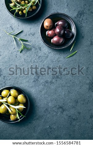 Whole green and black olives and capers . Flat lay. Copy space. Mediterranean cuisine