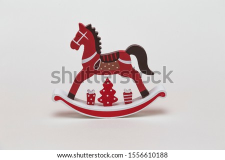 Red and white wooden Christmas rocking horse
