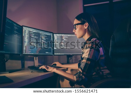 Side profile photo of smart intelligent clever girl typing new code while debugging the initial data of corporation security