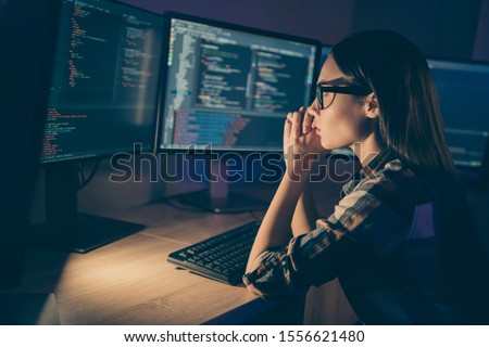 Photo of serious concentrated smart clever developer writing code for new video game to be released soon having to complete deadlines till morning