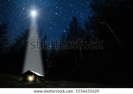 The moon shines over the manger of christmas of Jesus Christ. 