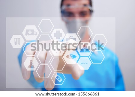 Hand touching first aid sign - abstract medical background