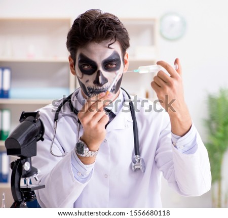 Scary monster doctor working in lab Royalty-Free Stock Photo #1556680118