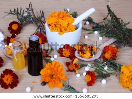  tincture of flowers of Chernobrivtsov in a small jar. selective focus