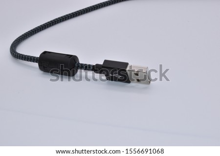 Ferrite for EMI suppression. Ferrite Clamp on USB Cable Type C and A. perfect for test and measuring purposes in EMC labs. Ferrite chokes. Fastening Pre-fixing for round cables. Clamping protection. Royalty-Free Stock Photo #1556691068