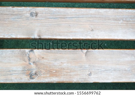 two boards on a background of green lawn