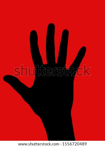 shadow of hand of  red background.