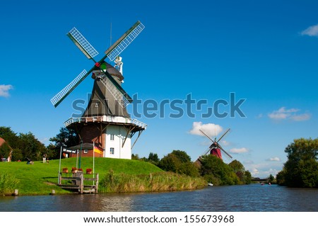 Twin windmills - Greetsiel - Germany Royalty-Free Stock Photo #155673968