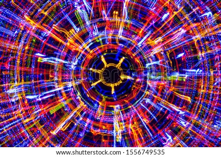 Circle neon lights with sparkling beams, bright laser lights background, modern nightlife and party concept, disco and dancing nightclubs pattern