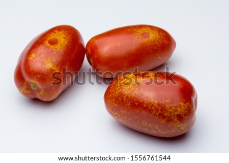 Damage from thrips bites in cherry pear tomato fruits Royalty-Free Stock Photo #1556761544