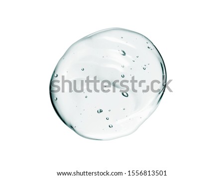 Serum texture. Clear cosmetic liquid gel swatch isolated on white background. Transparent skincare product drop with bubbles Royalty-Free Stock Photo #1556813501