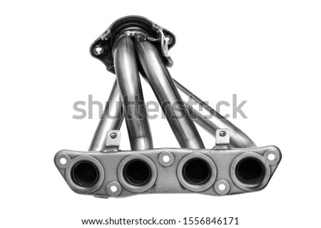Metallic new car exhaust manifold on a white background. The front of the exhaust system of an exhaust gas of an internal combustion engine. Royalty-Free Stock Photo #1556846171