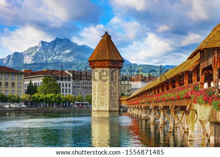 Sunrise in historic city center of Lucerne with famous Chapel Bridge and lake Lucerne (Vierwaldstattersee), Switzerland Royalty-Free Stock Photo #1556871485