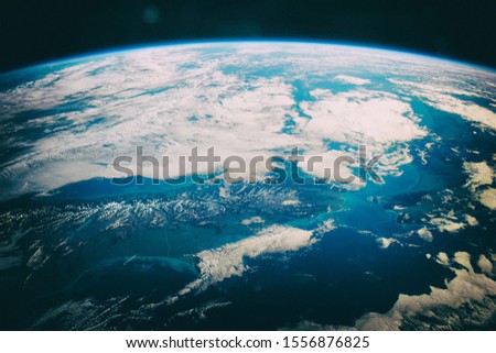 Earth, galaxy and stars.  The elements of this image furnished by NASA.
